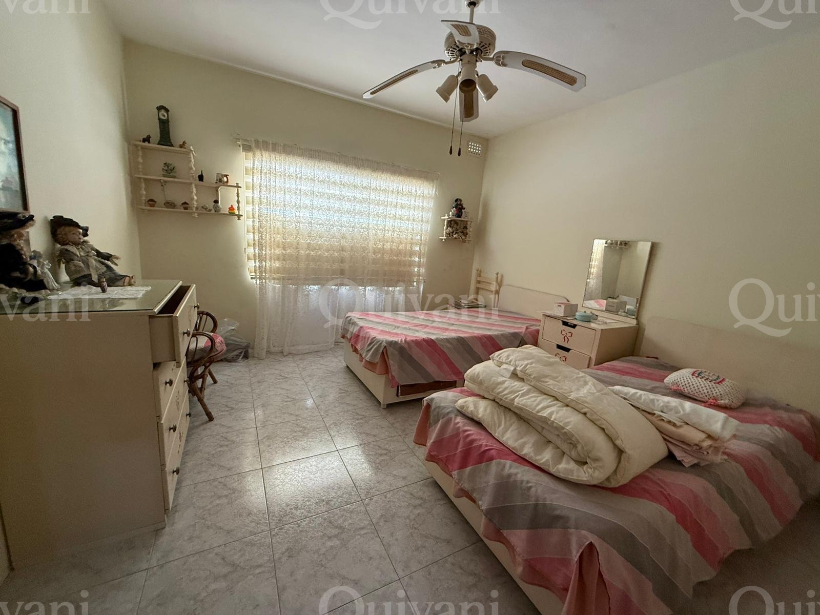 First floor apartment with an interconnecting street level garage and half ownership of airspace