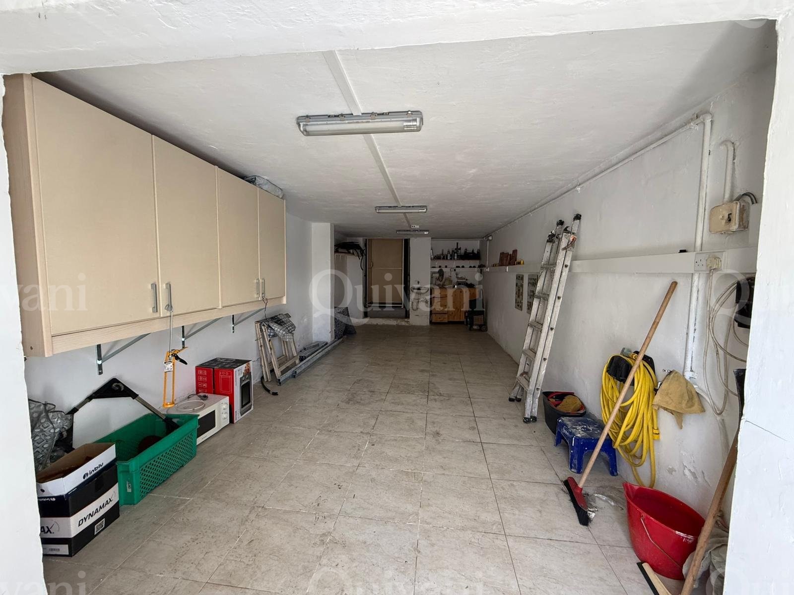 First floor apartment with an interconnecting street level garage and half ownership of airspace