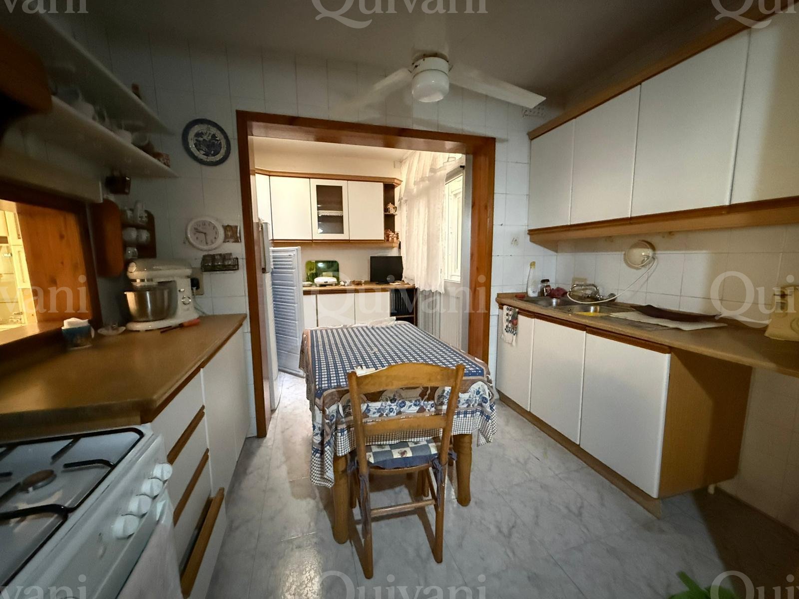 First floor apartment with an interconnecting street level garage and half ownership of airspace