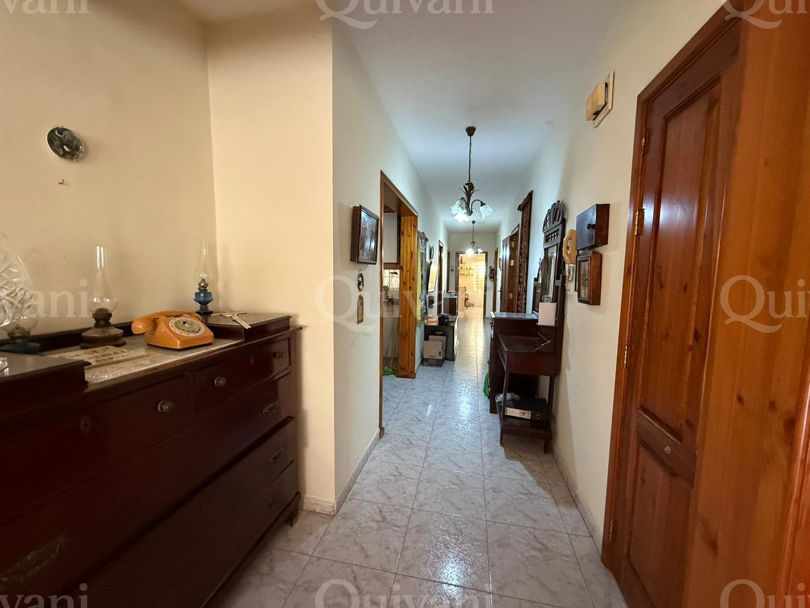 First floor apartment with an interconnecting street level garage and half ownership of airspace